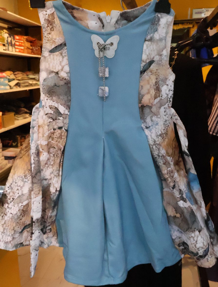 Elegant Blue Frock with Abstract Print Flare & Butterfly Charm – Girls Party Dress